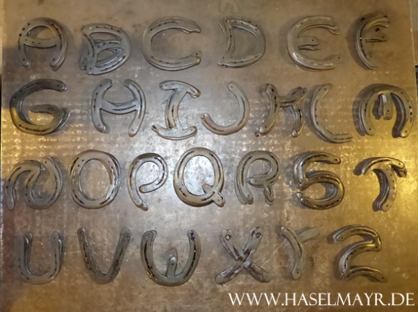 Hufeisen-Buchstabe X